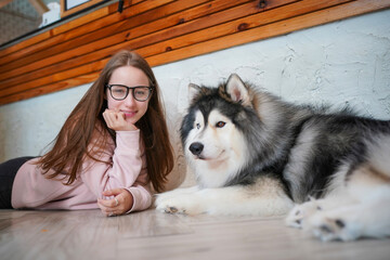 A snowy Siberian Husky portrait with Young girl
