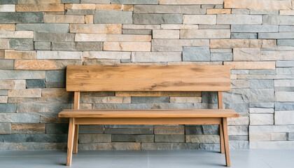 Minimalist wooden bench in front of a textured stone wall, showcasing elegant design and architectural simplicity.