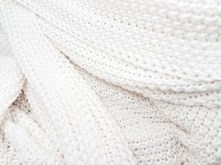 A cozy white knitted plaid background with soft, minimalist details and woven charm.