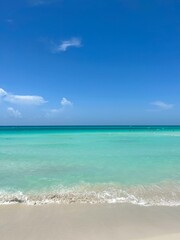 Tropical beach with turquoise water and clear blue sky