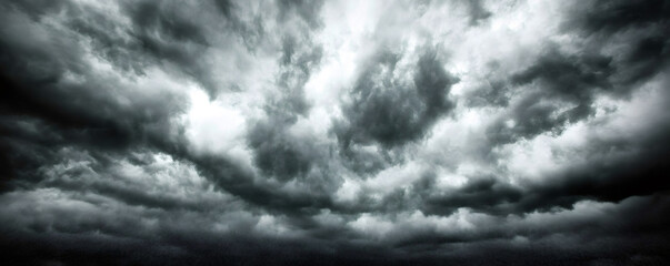 Dramatic storm clouds gathering in the dark sky before a thunderstorm, creating a breathtaking and intense natural display
