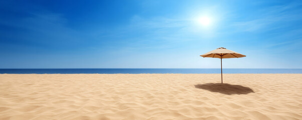 Tranquil tropical beach scene with beach umbrella and golden sand stretching towards clear sea