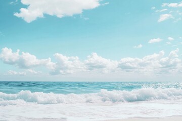 Fototapeta premium A person stands on the beach holding a surfboard, ready to hit the waves