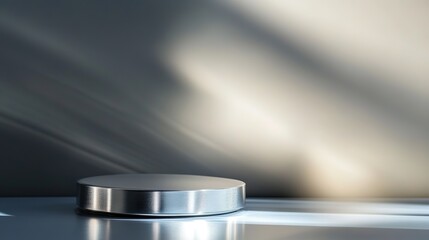 Metallic pedestal on sleek surface with dramatic lighting.