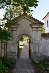 Historic Brick Archway with Greenery in Summer Light
