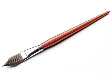 Fototapeta premium A close-up shot of a paintbrush lying on a white surface, ready for use in artistic projects