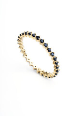 fine gold ring with black shiny stones