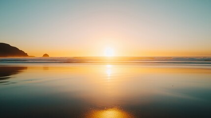 Fototapeta premium Golden sunset reflecting on calm ocean waves at the beach with distant cliffs and serene atmosphere