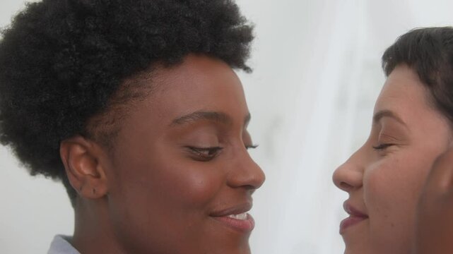 Close up detail of lesbian couple in gentle gesture of affection &nbsp;