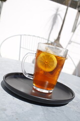 Hot cup of tea with lemon on a beautiful morning