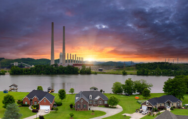 Air pollution from electric energy production from fossil fuel. Residential community homes near...