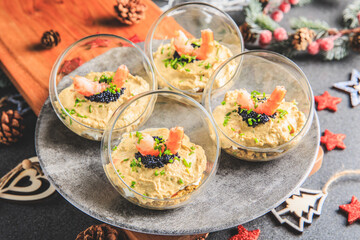 Verrine avocado shrimp pink fresh cheese guacamole chives cream lumpfish roe - decorated for Christmas
