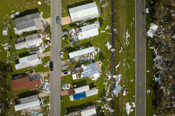 Destroyed by hurricane Ian suburban houses in Florida mobile home residential area. Consequences of...