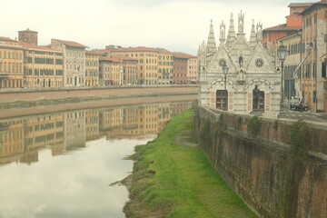 Small church. Church of the Spina in PisaTiny white marble Gothic church built on the banks of the Arno River.. Italy