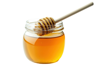 A close-up shot of honey in a jar with a wooden honey dipper for culinary use. transparent background.