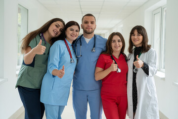 Group of medical team studetns or young doctors in uniform  in college hallway