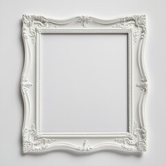 Empty ornate white picture frame on plain background