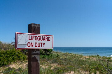 Obraz premium A lifeguard on duty sign at Jersey shore beach
