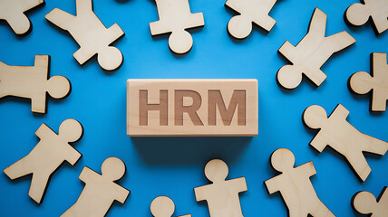 Obraz premium HRM: Human Resources Management, Employee Engagement, Recruitment, and Organizational Growth, human resources management concept. Wooden figures on the blue background, hrm copy space, hrm background