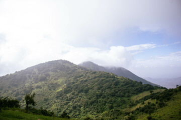 A view of the hills on a foggy cloudy morning. 