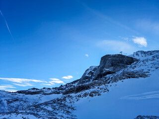 Overhead cable car on Hintertux Glacier in Tyrol, Austria Alps. Sunny day ski lift winter scenery.
