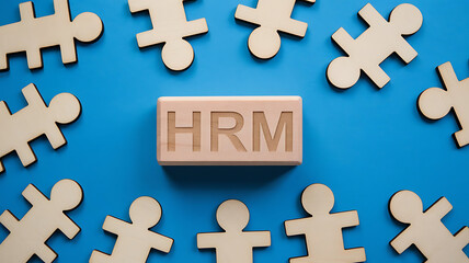 Obraz premium HRM: Human Resources Management, Employee Engagement, Recruitment, and Organizational Growth, human resources management concept. Wooden figures on the blue background, hrm copy space, hrm background