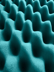 Close up em textura de espuma de isolamento acústico, na cor verde. Espuma caixa de ovo verde.