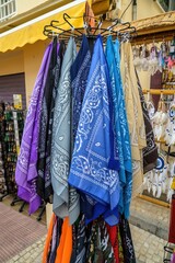 Display of scarves in a small market in an alley