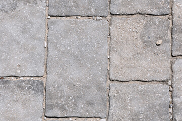 The texture of the wall is composed of gray, rough stone.