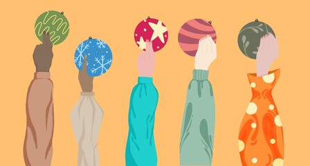 Hand holding Christmas accessories ready to decorate