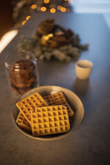 Waffles with chocolate sauce for christmas. Homemade fresh golden waffles delicious breakfast. Top side close up view of healthy seasonal refreshment diet. 