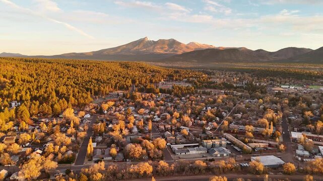 Aerial panorama of Flagstaff residential area in the morning sunlight, the San Francisco mountains in the background	
