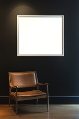 Empty frame on dark wall above chair in minimalist interior