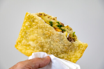 Traditional Brazilian fried pastry stuffed with ground beef. "Pastel de feira".