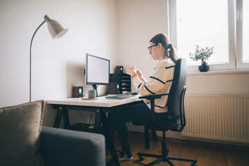 Focused young woman working from home