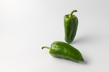 Close-up of fresh green bell pepper isolated on white background