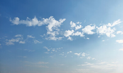 Fototapeta premium Summer evening or winter evening blue sky cloud gradient light white background. Gloomy vivid cyan. Morning sky looked like a bright golden sky. Sunrise is decorated with clouds in various shapes.
