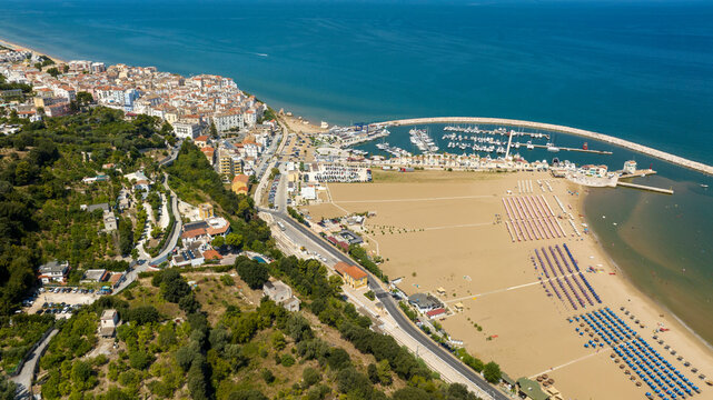 Aerial view of Levante beach and the marina of Rodi Garganico. It is a tourist destination in Gargano, in the province of Foggia, Puglia, Italy. The town overlooks the Adriatic Sea.