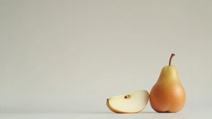 Whole pear with an artistic slice beside it, clean white background highlighting its freshness