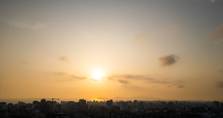 panomaric photo of a summer sunset in a  big city 