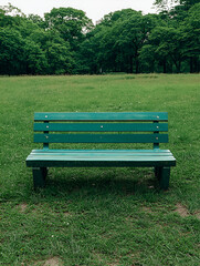 Empty bench, green park, calm day.