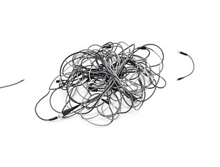 Bundle of electrical cables against black studio backdrop, technology, group, entangled, collection