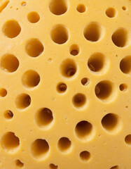 Obraz premium Fresh yellow cheese with big holes texture background