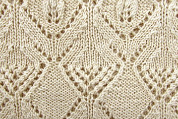 Texture of white or gray knitted material. Knitting