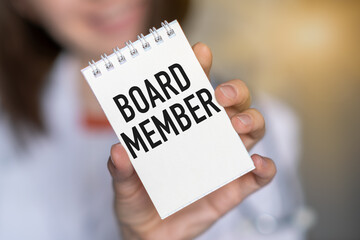 Business woman with notebook with text Board Member. Business concept
