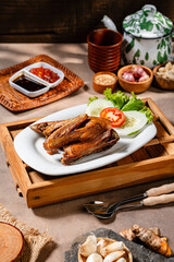 Bebek Goreng, Traditional Fried Duck. Popular Menu came from Madura, East Java. served with sambal, cucumber, tomato and lettuce.