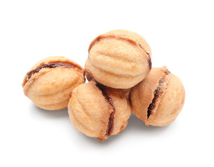 Many sweet walnut shaped cookies with boiled condensed milk on white background