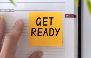 GET READY text on the cover of the notebook. two notepads on the desk. Business concept. Flat lay, top view