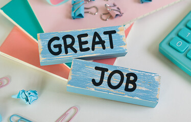 Closeup on businessman holding a wooden block with Great Job, Business concept