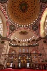 Stunning interior of the Suleymaniye Mosque in Istanbul. Designed by the imperial architect Mimar Sinan, it was inaugurated in 1557.